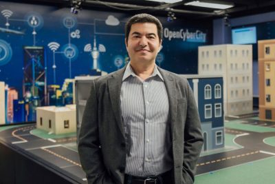 Sherif Abdelwahed in front of the smart cities model
